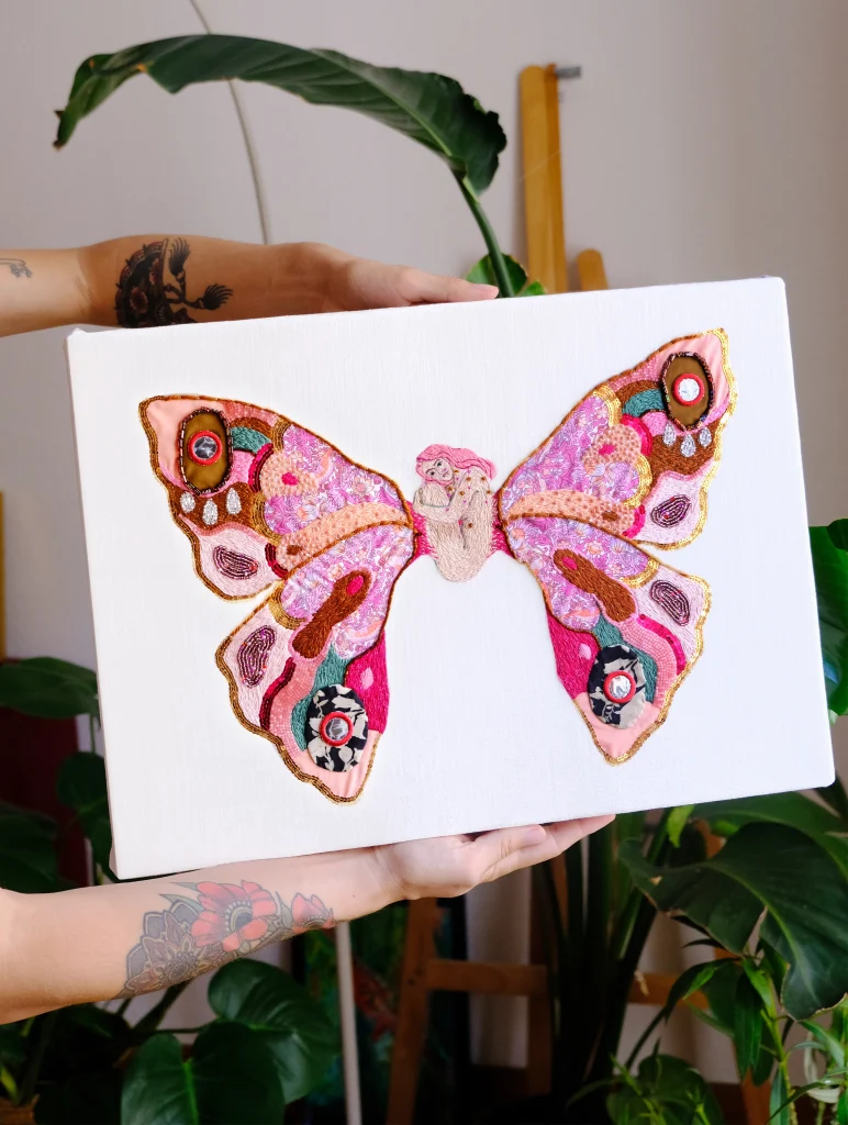 surreal butterfly embroidery with woman